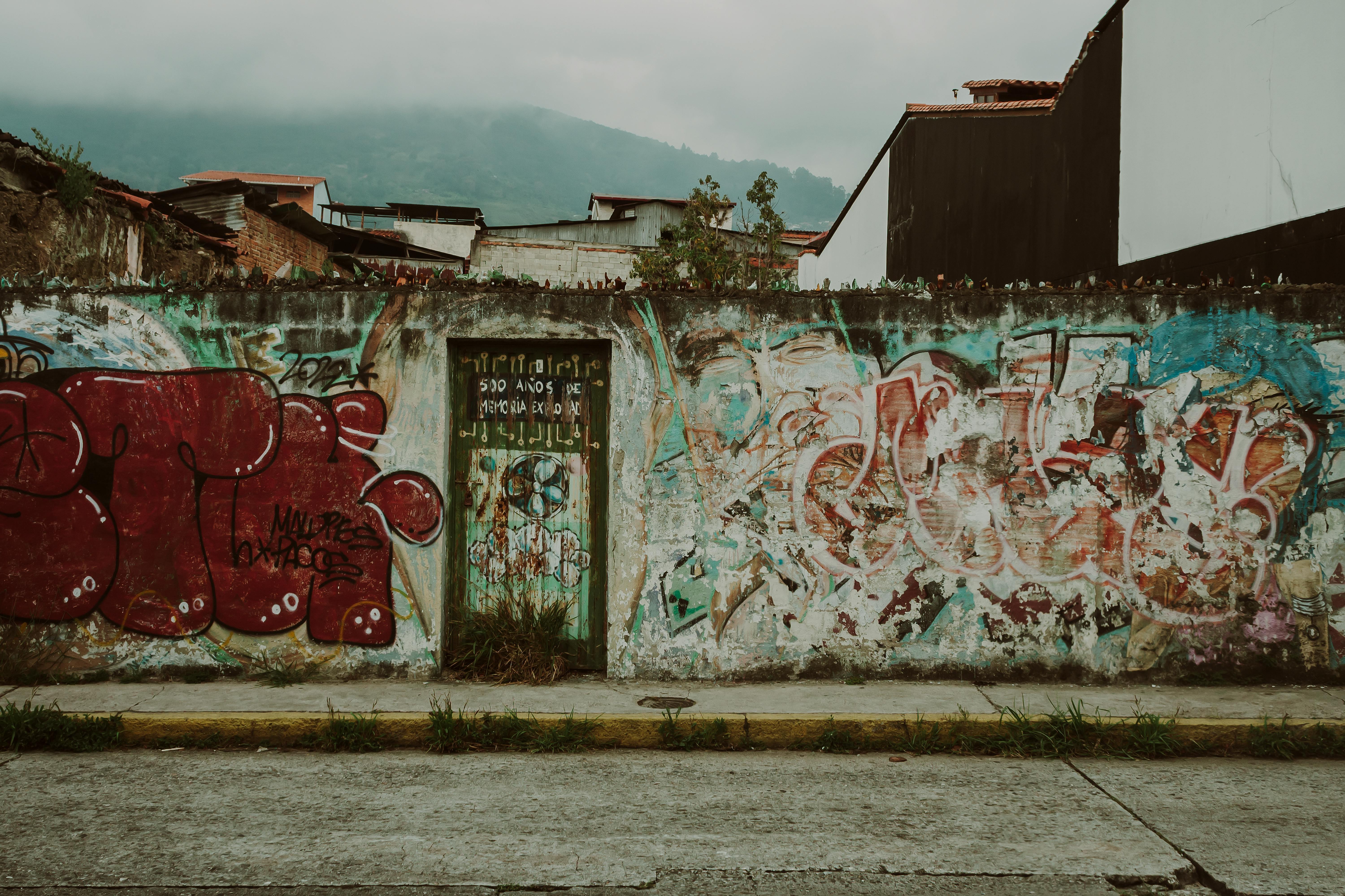 Graffiti-covered wall before removal